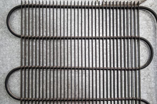 A close-up of fridge coils